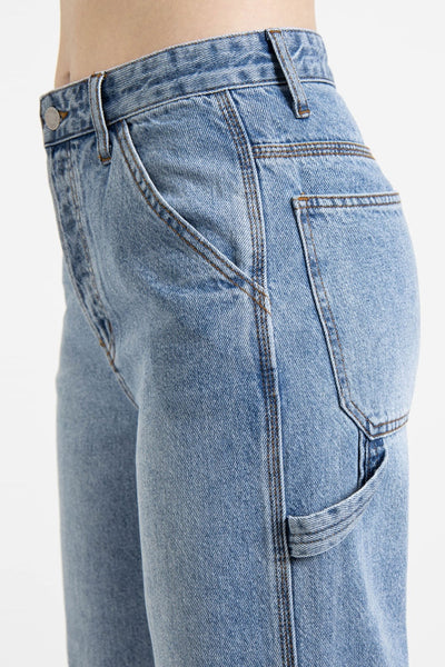 Enjoy the perfect blend of comfort and utility with this ultra high-rise carpenter jean. The high-waisted fit will keep you looking stylish while the cargo loops and baggy wide legs provide plenty of interesting details! Say hello to your new favorite jeans!