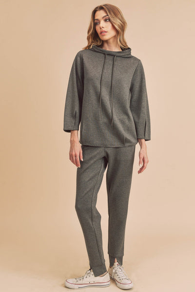 This lounge top is a lightweight yet durable staple, designed in a loose fit with a draped shoulder, and finished with a drawstring. These pants that take you from the gym to wherever you need to go. Designed with split hem at the ankles and two front pockets, these joggers are not only versatile but fashion-forward.