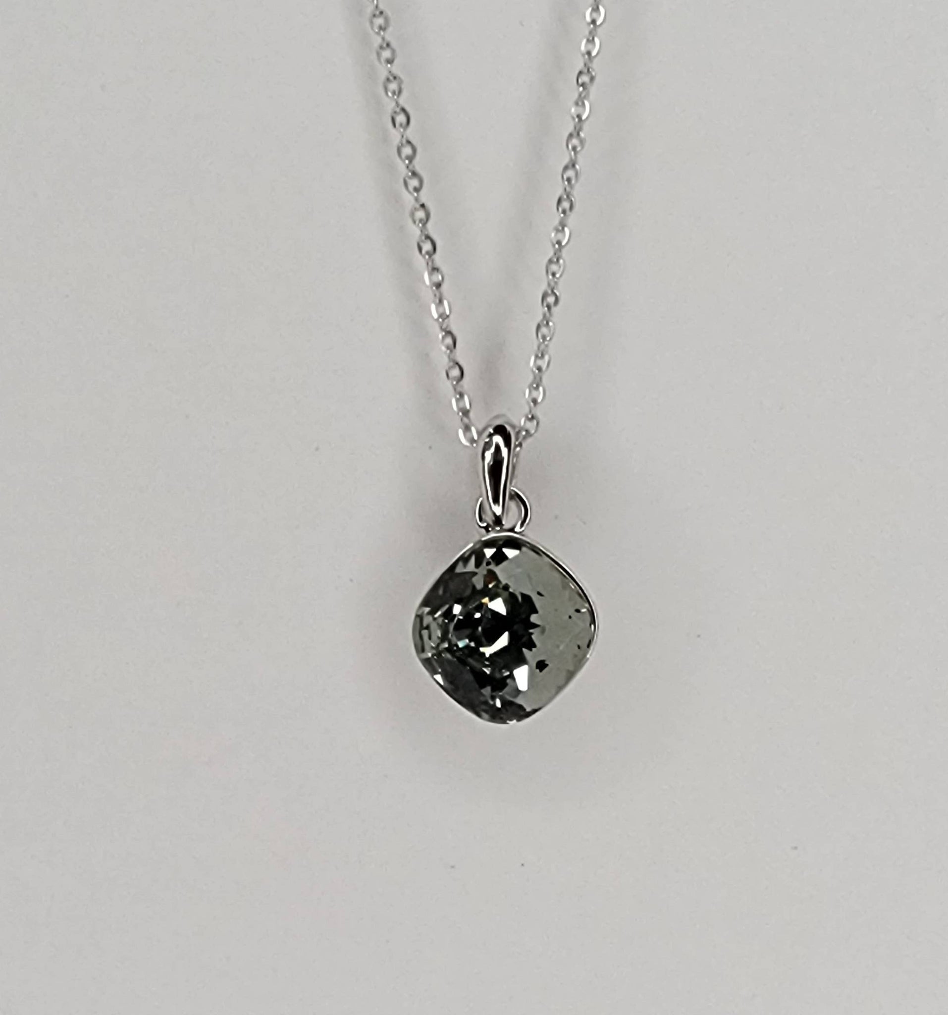 SWAROVSKI CRYSTAL CHARM NECKLACE.: SMOKEY/SILVER