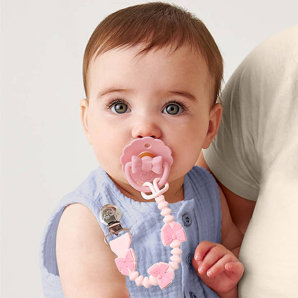 Itzy Paci Strap Plus™: Pink Bows