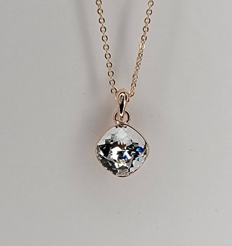 SWAROVSKI CRYSTAL CHARM NECKLACE.: CLEAR/ROSE GOLD