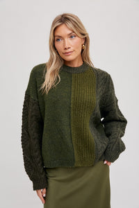 A wardrobe essential, this knitted texture color block sweater is designed with a soft-touch viscose blend for comfortable all-day wear. With its bold color block pattern and slim-fit silhouette, this sweater is perfect for any occasion.