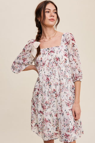 Look fabulous and feminine in our Deep Rose Square Neck Button Front Dress! Delicate floral print adorns this chiffon dress with square neck, puff mid sleeves with elastic cuffs, and a tiered skirt complete with hidden side seam pockets. 