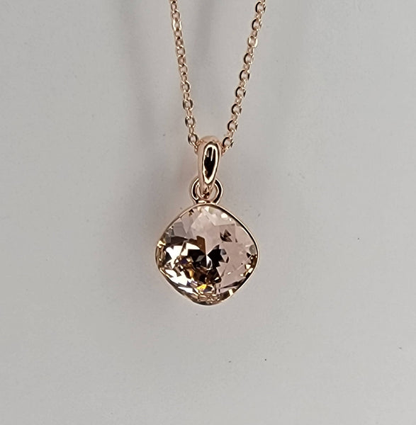 SWAROVSKI CRYSTAL CHARM NECKLACE.: CLEAR/GOLD