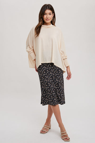 This Flower Print Bias Skirt is a stunning midi skirt crafted from lightweight fabric. The bias cut design creates a flattering silhouette, while the vibrant flower print makes it an ideal statement piece. An elegantly stylish addition to any wardrobe.