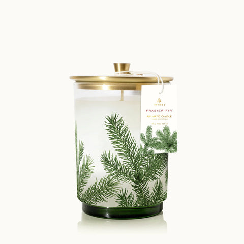 Snow-white wax poured into clear glass, embellished with the classic pine needle design is truly an illuminating focal point, filling your surroundings with Frasier Fir.