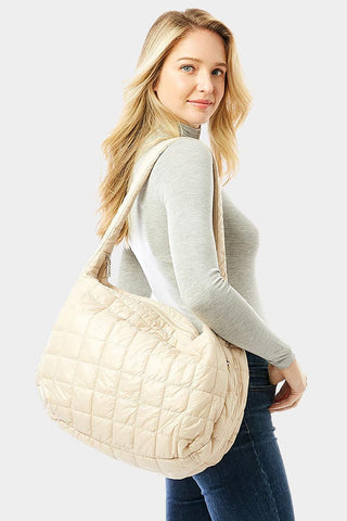 Wrap yourself in luxury with this chic quilted puffer hobo bag! Featuring two side zipper pockets, a secure zipper closure, and an oh-so-stylish look, this bag will keep your look on-point no matter where you go! Looking good, and feeling safe, never looked this good!