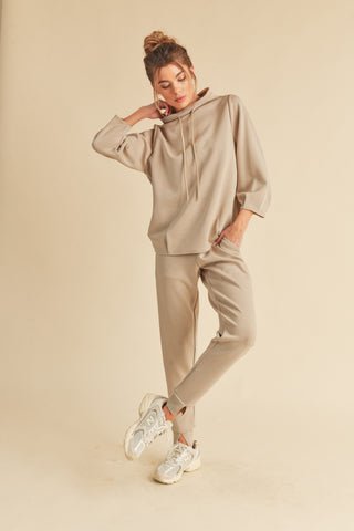 This lounge top is a lightweight yet durable staple, designed in a loose fit with a draped shoulder, and finished with a drawstring. These pants that take you from the gym to wherever you need to go. Designed with split hem at the ankles and two front pockets, these joggers are not only versatile but fashion-forward.