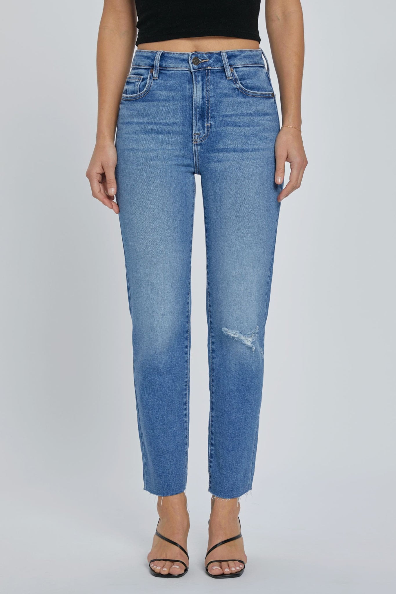 The Tracey High Rise Straight Denim in Medium Blue is designed for all-day comfort and style. These straight fit jeans have a high rise waist, an easy fit from hip to ankle, and a medium blue wash. The soft, stretchy fabric ensures a comfortable fit.