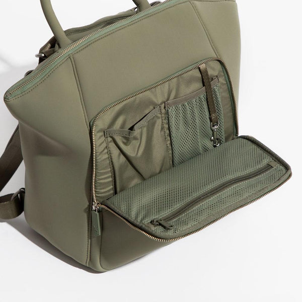 Meet Seoul, the new neoprene collection by Freshly Picked. Our lightweight neoprene bags are machine washable (without the bag losing its shape) and weather resistant. Inspired by athleisure and everything in between, this bag is an essential for mama. An all-in-one strap lets you convert it from a backpack to a crossbody in seconds with a padded shoulder strap for everyday comfort. Engineered for the Mom in Motion