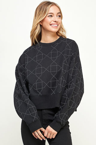 The contrasting quilted pattern on this sweater make it perfectly comfy chic! 