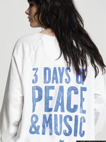 We’re binging all 3 days of peace & music in this vintage style Woodstock sweatshirt! Recycled Karma's bold graphic sweatshirt is designed with the iconic bird and guitar logo on the front with, “3 Days Of Peace & Music” type on the back. Made with soft vintage washed fabric, our perfectly oversized sweatshirt is finished with a relaxed crew neckline, and ribbed hems.